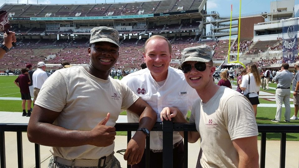 Two Air Force ROTC cadets with MSU President Mark Keenum