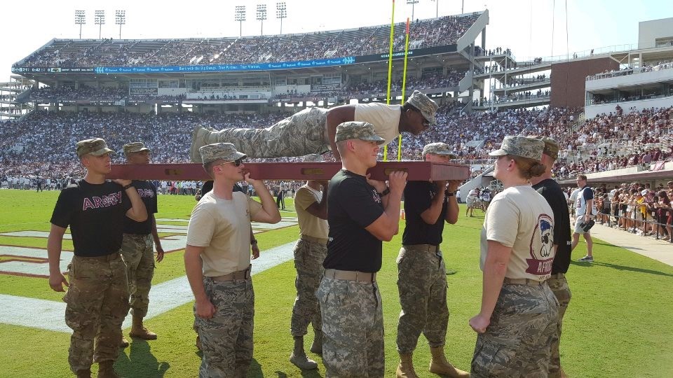 Air Force cadet performs push-ups after MSU scores